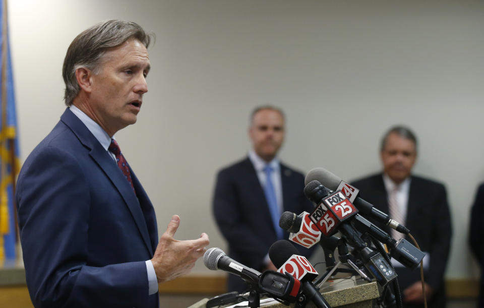 Oklahoma Attorney General Mike Hunter speaks to the media at a news conference following closing arguments in Oklahoma's ongoing opioid drug lawsuit against Johnson & Johnson Monday, July 15, 2019, in Norman, Okla. (AP Photo/Sue Ogrocki)