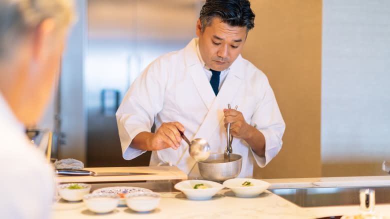 Chef cooking in open kitchen