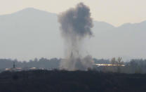 Smoke rises during shelling by Azerbaijan's artillery near Stepanakert, the separatist region of Nagorno-Karabakh, Wednesday, Oct. 28, 2020. Nagorno-Karabakh officials said Azerbaijani forces hit Stepanakert, the region's capital, and the nearby town of Shushi with the Smerch long-range multiple rocket systems, killing one civilian and wounding two more. (AP Photo)