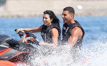 <p>Kourtney and her boyfriend (of the moment), Younes Bendjima, hit the water on a Jet Ski. Kourt rocked a sexy black one-piece for the occasion that featured many sexy cutouts. (Photo: Kourtney Kardashian via Instagram) </p>