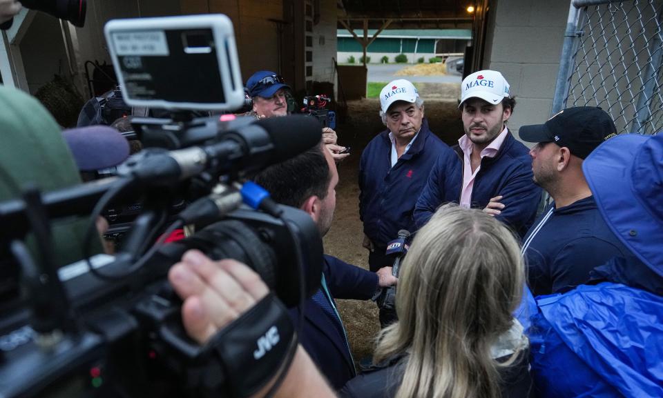 A gaggle of press surrounds trainer Gustavo Delgado and his son assistant trainer Gustavo Delgado Jr. the morning after winning the Kentucky Derby on Sunday, May 7, 2023 at Churchill Downs in Louisville. Javier Castellano aboard Mage won the 149th running of the Kentucky Derby. 