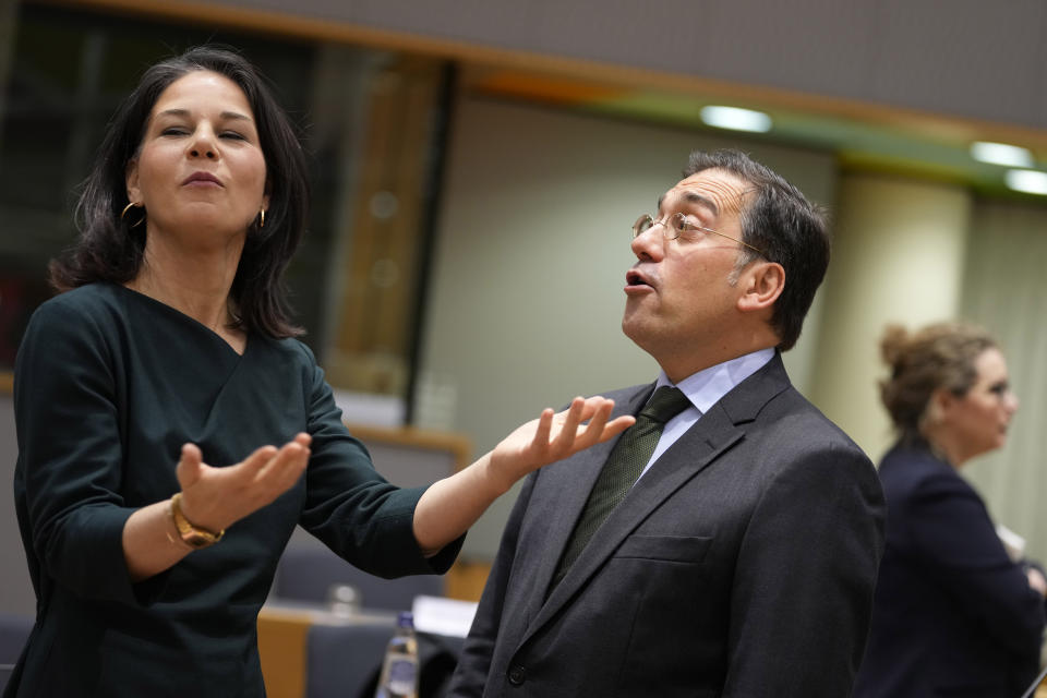 Germany's Foreign Minister Annalena Baerbock, left, speaks with Spain's Foreign Minister Jose Manuel Albares Bueno during a meeting of EU foreign ministers at the European Council building in Brussels, Monday, Jan. 22, 2024. European Union Foreign Affairs Ministers meet in Brussels on Monday to discuss the situation in the Middle East and in Ukraine. (AP Photo/Virginia Mayo)