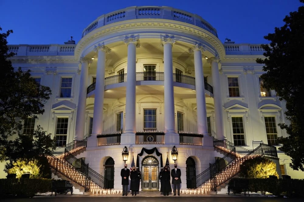 From left, President Joe Biden, First Lady Jill Biden, Vice President Kamala Harris and her husband Doug Emhoff, stand outside the White House during a ceremony to honor the 500,000 Americans that died from COVID-19, Monday, Feb. 22, 2021 in Washington. (AP Photo/Evan Vucci)