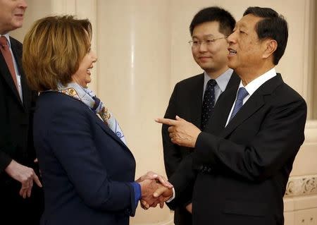 U.S. House Minority Leader Nancy Pelosi (L) speaks with with Zhang Ping, Vice Chairman of China's National People's Congress, as she arrives for a bilateral meeting at the Great Hall of the People in Beijing, Thursday, Nov. 12, 2015. REUTERS/Mark Schiefelbein/Pool