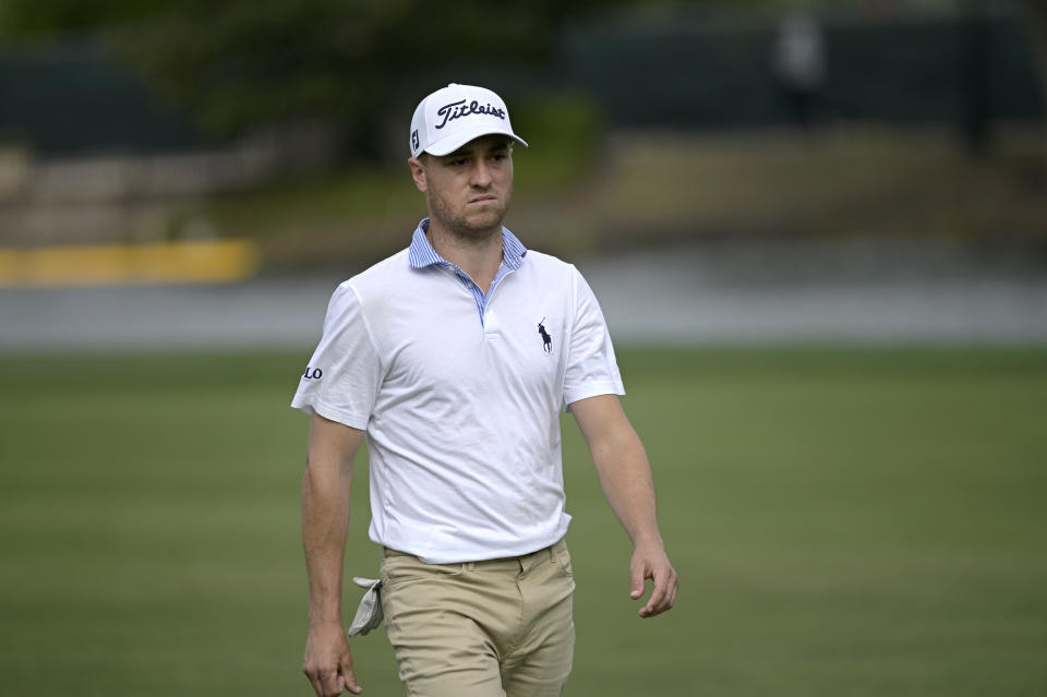 Justin Thomas walks to the 18th green during the final round of the PNC Championship golf tournament, Sunday, Dec. 20, 2020, in Orlando, Fla. (AP Photo/Phelan M. Ebenhack)