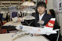 Yu Gao of China may have the answer to the future of aircraft safety. She has devised an emergency landing system which uses multi-layered parachutes for aeroplanes to be deployed in the event of an emergency. Her unusual idea is one of more than 700 concepts on show at the three-day event in Switzerland.