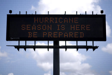 A traffic sign warns of hurricane season in Stowell, Texas, U.S., June 12, 2018. Picture taken June 12, 2018. REUTERS/Jonathan Bachman