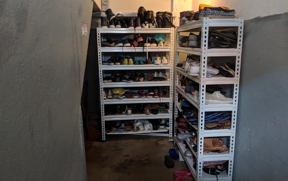 Shoes lining the racks at HOME's shelter, which is at an undisclosed location. (PHOTO: Wong Casandra/Yahoo News Singapore)