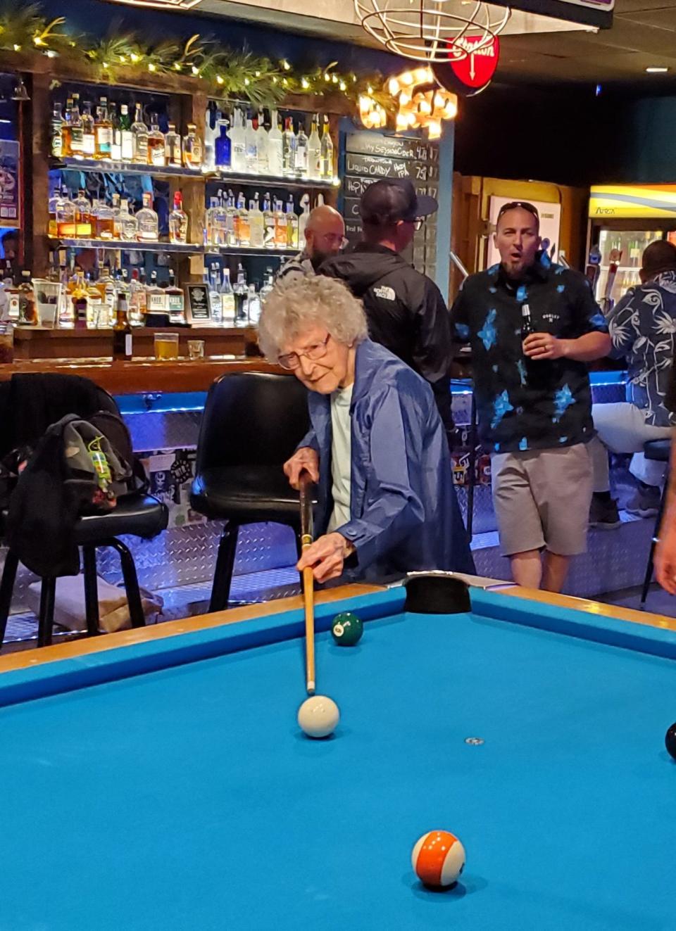 Teresina Piano plays pool at The Garage in 2022, shortly before she turned 105.