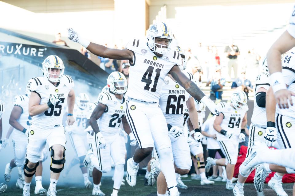 Western Michigan players take the field for the season opening game against Saint Francis at Waldo Stadium on Thursday, Aug. 31, 2023.