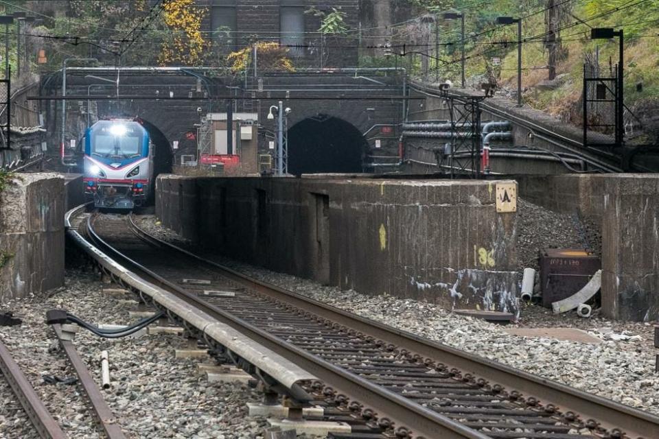 An Amtrak train emerges from the Hudson River rail tunnel in New Jersey.