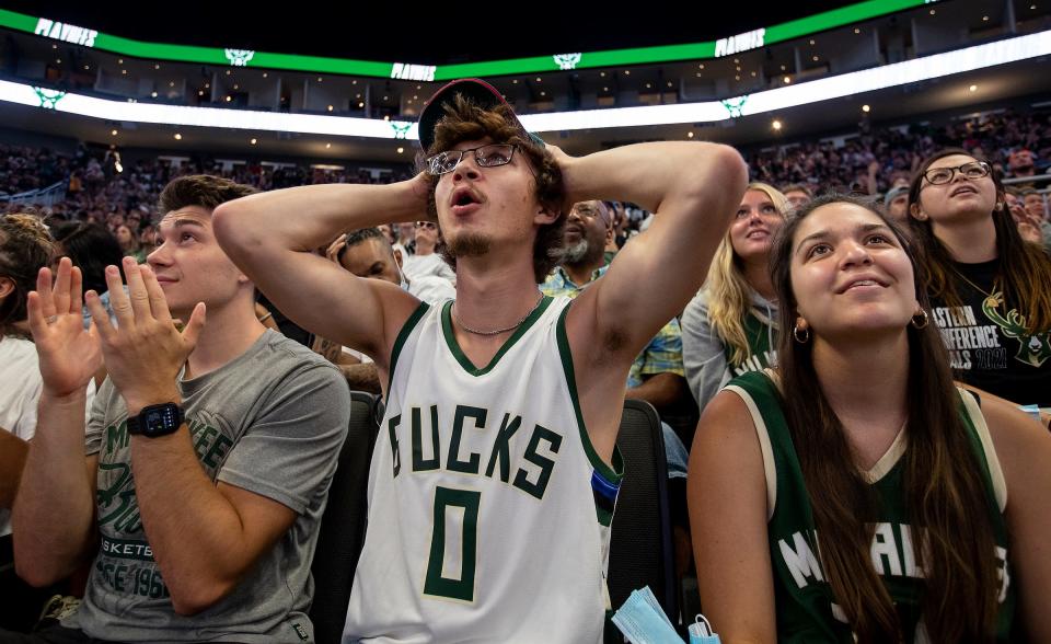 Fans react to a missed free-throw by the Milwaukee Bucks at the watch party inside Fiserv Forum as the team took on the Phoenix Suns in Game 1 of the NBA Finals on Tuesday, July 6, 2021.