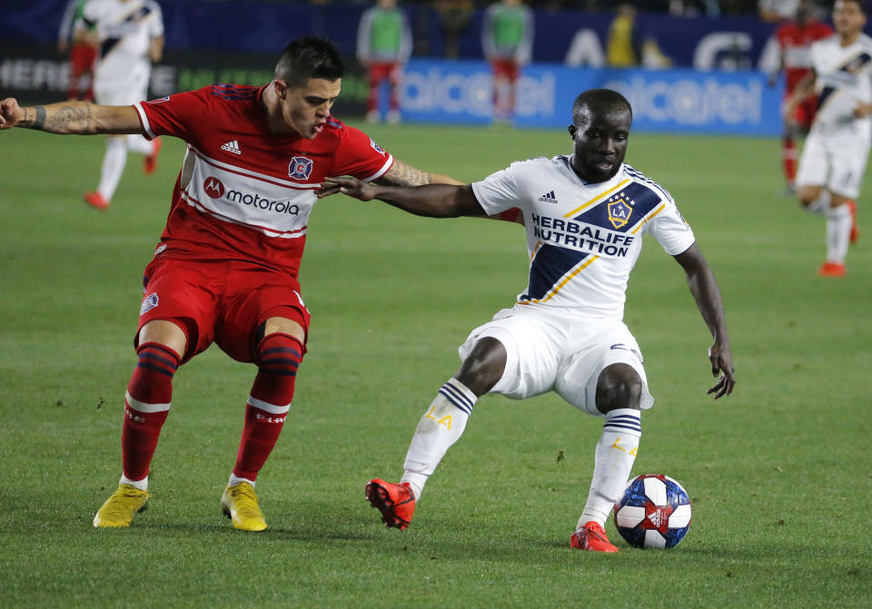 LA Galaxy midfielder Emmanuel Boateng, right, of Ghana, and Chicago Fire forward Diego Campos, of Costa Rica, vie for the ball in the second half of an MLS soccer match in Carson, Calif., Saturday, March 2, 2019. (AP Photo/Ringo H.W. Chiu)