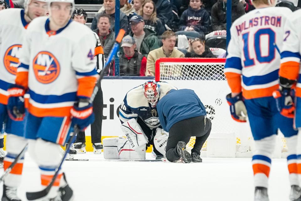 Apr 4, 2024; Columbus, Ohio, USA; A trainer tends to Columbus Blue Jackets goaltender Daniil Tarasov (40) during the first period of the NHL hockey game against the New York Islanders at Nationwide Arena.