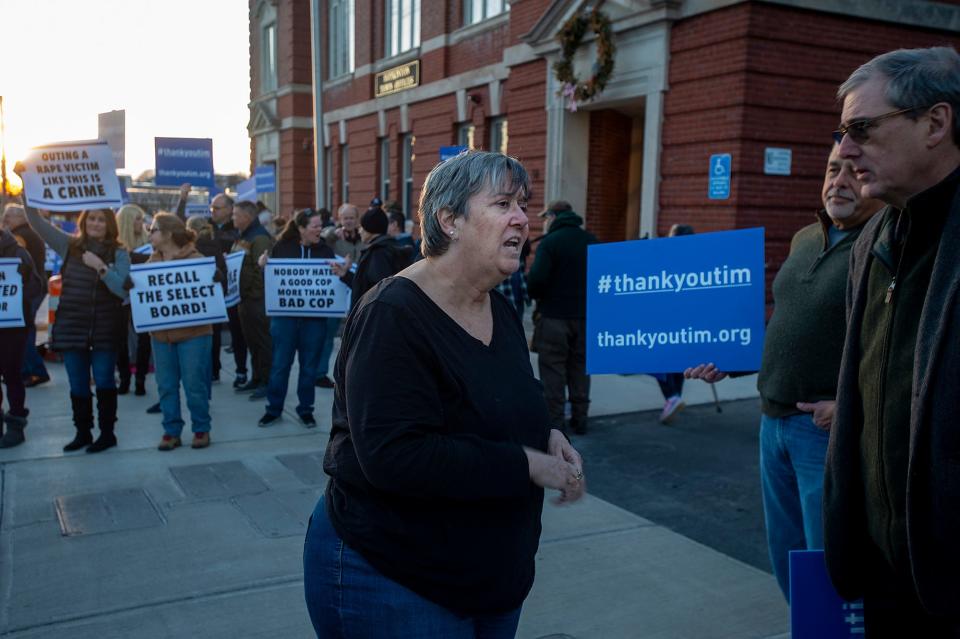 Hopkinton Select Board Chair Muriel Kramer speaks with supporters of police Sgt. Timothy Brennan outside Town Hall before an executive session, Feb. 8, 2024. The Select Board would vote 4-1 to accept Police Chief Joseph Bennett's recommendation to terminate Brennan for not reporting an alleged child rape committed years earlier by a fellow officer. Kramer was the lone dissenting vote.