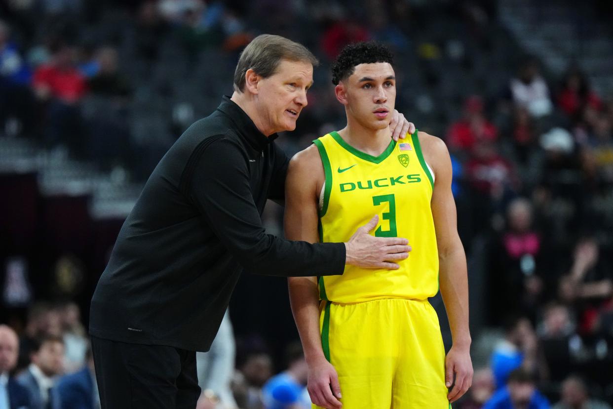 Oregon Ducks head coach Dana Altman talks with guard Jackson Shelstad (3) in the second half against the UCLA Bruins at T-Mobile Arena March 14, 2024, in Las Vegas.
