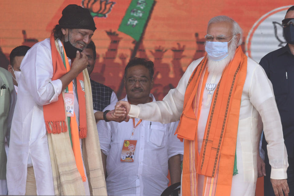 KOLKATA, INDIA  MARCH 7: Prime Minister Narendra Modi with actor Mithun Chakraborty who joined the Bharatiya Janata Party (BJP) today a public rally at Brigade Parade Ground on March 7, 2021 in Kolkata, India. Prime Minister Narendra Modi addresses the mega poll rally as West Bengal heads for an eight-phase assembly election starting March 27. This is one of his many rallies planned by the BJP which is aiming to utilise PM Modi's star power to intensify its campaign against the TMC. (Photo by Samir Jana/Hindustan Times via Getty Images)