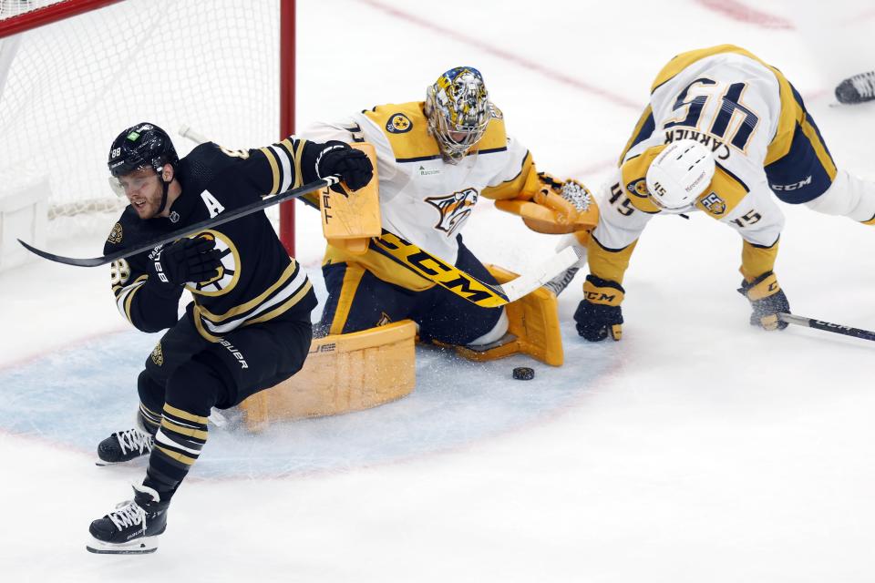 Nashville Predators' Juuse Saros (74) blocks the shot by Boston Bruins' David Pastrnak (88) during the second period of an NHL hockey game, Saturday, Oct. 14, 2023, in Boston. Paternak was awarded a penalty shot after a holding call on Alexandre Carrier (45) on the breakaway. (AP Photo/Michael Dwyer)