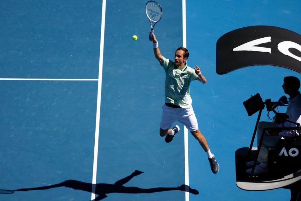 Daniil Medvedev leaps to hit a shot (Hamish Blair/AP) (AP)