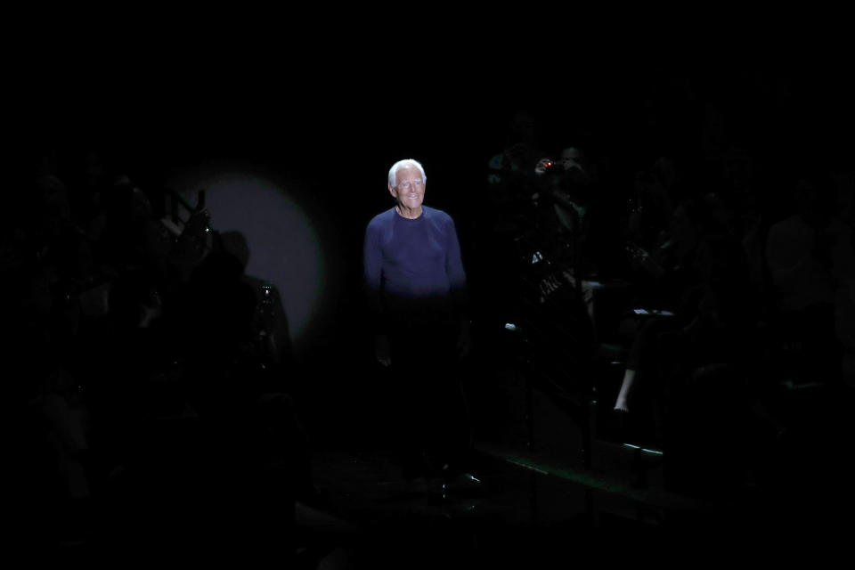 Designer Giorgio Armani accepts applause at the conclusion of the Emporio Armani Spring-Summer 2020 collection, unveiled during the fashion week, in Milan, Italy, Thursday, Sept. 19, 2019. (AP Photo/Antonio Calanni)