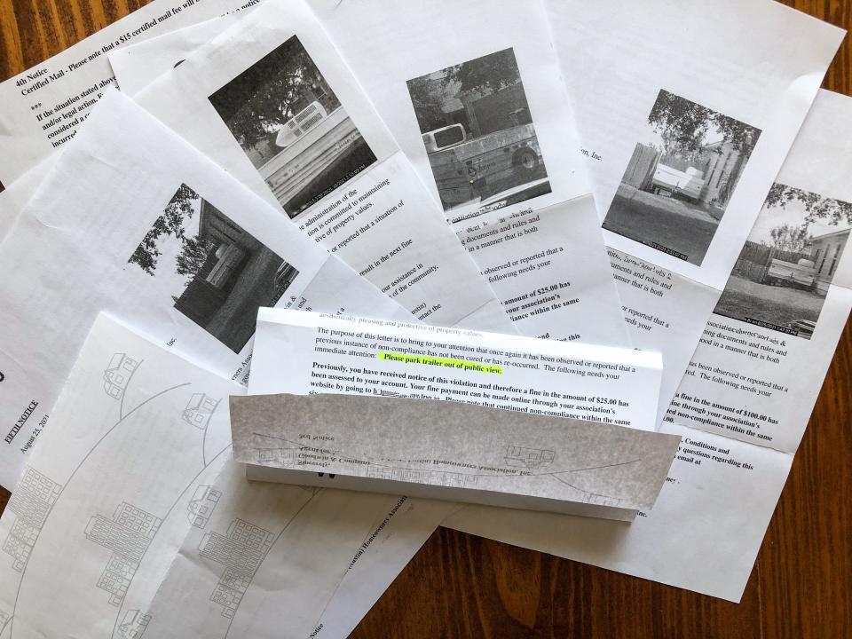 Paper work laid out on a wooden table