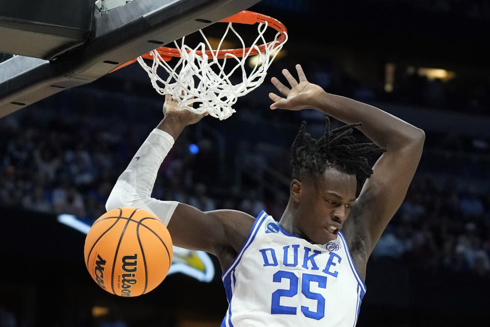 Duke forward Mark Mitchell (25) finishes a slam dunk against Oral Roberts during the first half of a first-round college basketball game in the NCAA Tournament Thursday, March 16, 2023, in Orlando, Fla. (AP Photo/Chris O'Meara)