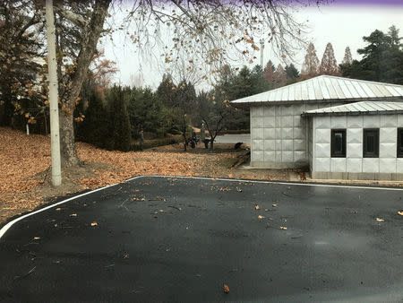 North Korean soldiers dig a trench and plant trees in the area where, on November 13, a defector ran across the border at the Demilitarized Zone (DMZ) dividing North Korea and South Korea November 22, 2017. Picture taken November 22, 2017. Handout via REUTERS