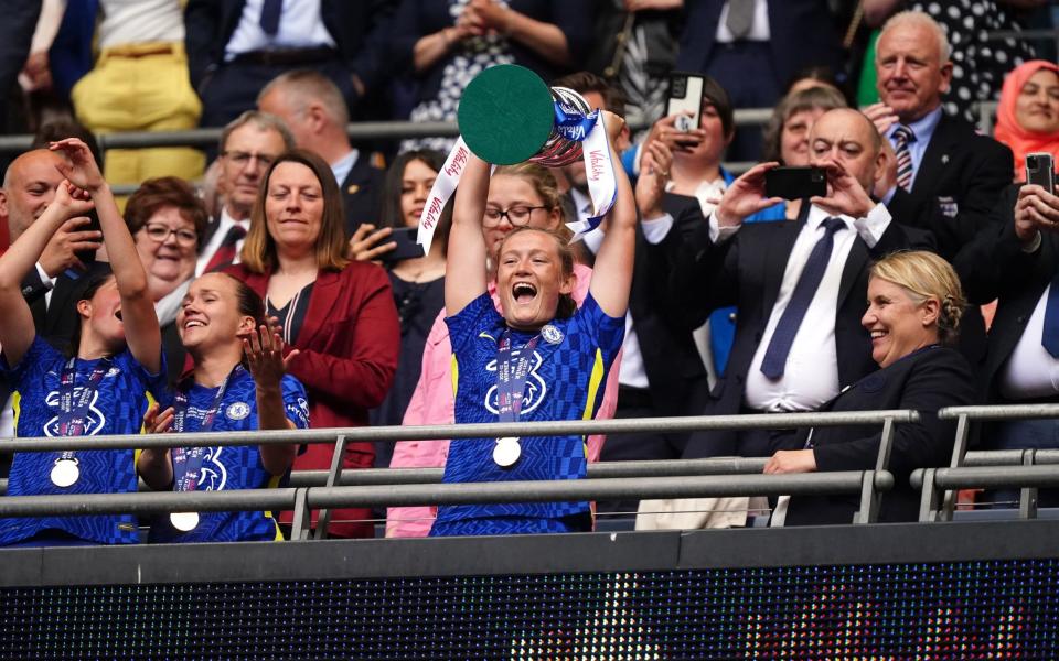 Cuthbert deservedly enjoying herself as she lifts the FA Cup - PA