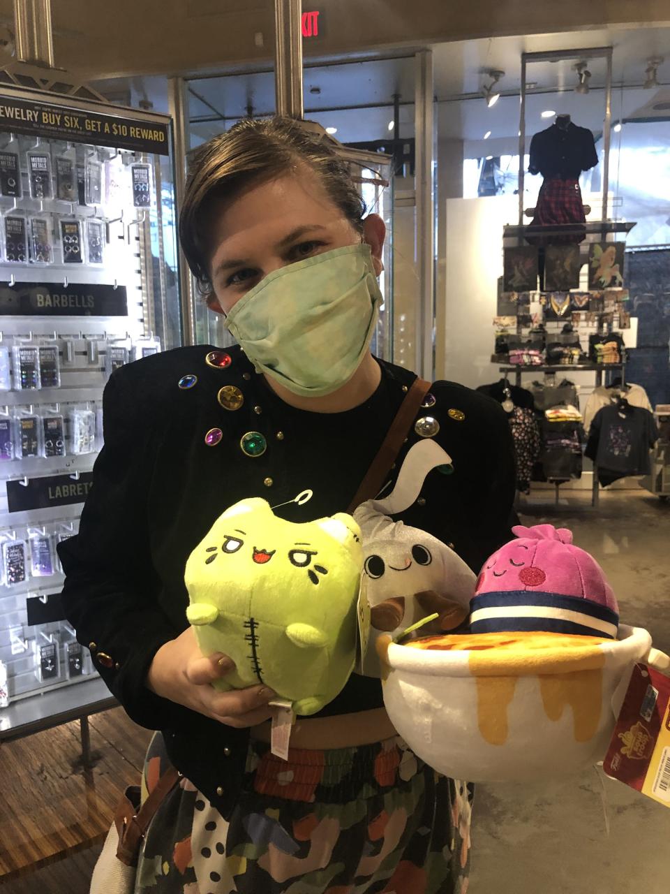 Author's friend holding cute stuffed animals