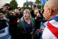 Pro-Brexit and anti-Brexit demonstrators argue at the Parliament Square as parliament sits on a Saturday for the first time since the 1982 Falklands War, to discuss Brexit in London