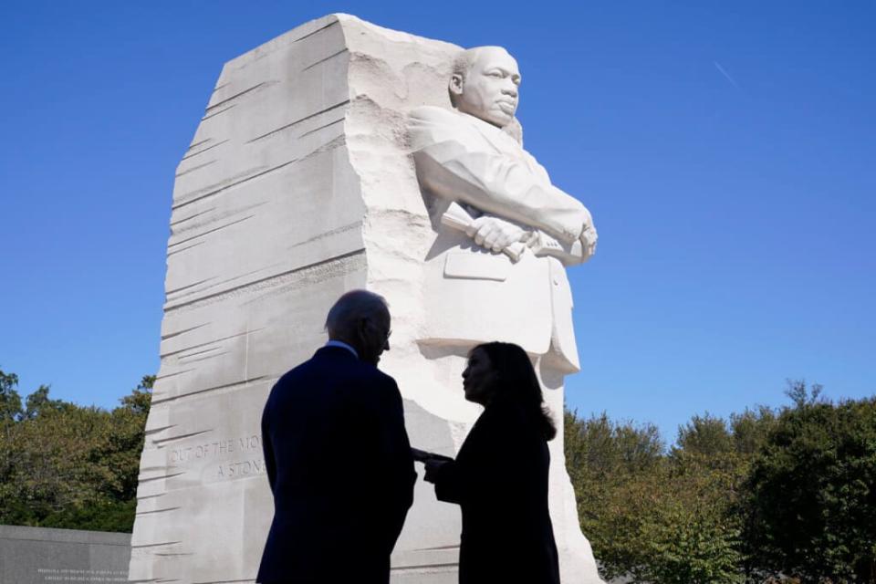 President Joe Biden and Vice President Kamala Harris stand together at the Martin Luther King, Jr. Memorial as they arrive to attend an event marking the 10th anniversary of the dedication of memorial in Washington, Oct. 21, 2021. (AP Photo/Susan Walsh, File)