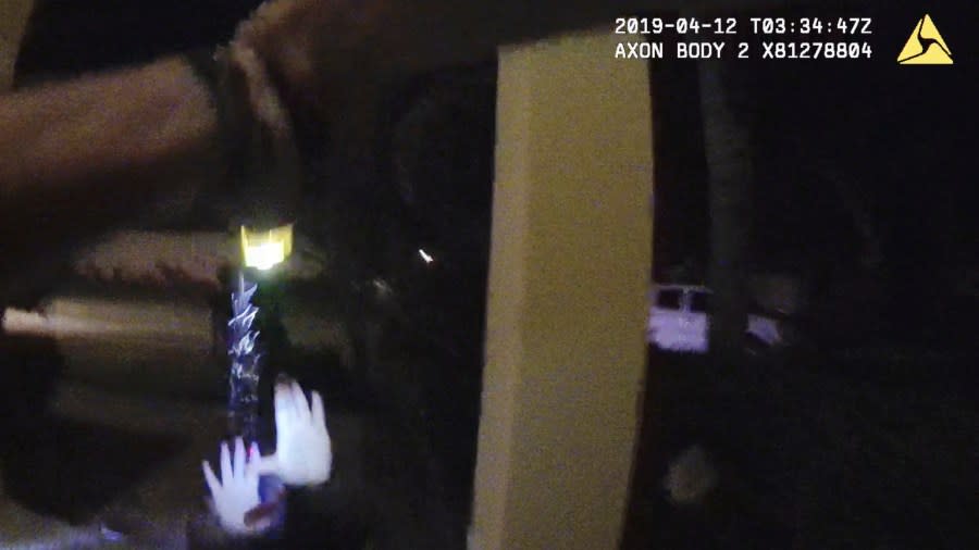 In this image from Ocoee Police Department body-camera video, an officer uses a Taser against Samuel Celestin at the entrance of his home in Ocoee, Fla., on April 11, 2019. Taser logs showed officers fired as many as 10 times for a total of nearly 60 seconds — far more than the device’s manufacturer recommends — although it wasn’t clear if all the deployments connected. (Ocoee Police Department via AP)