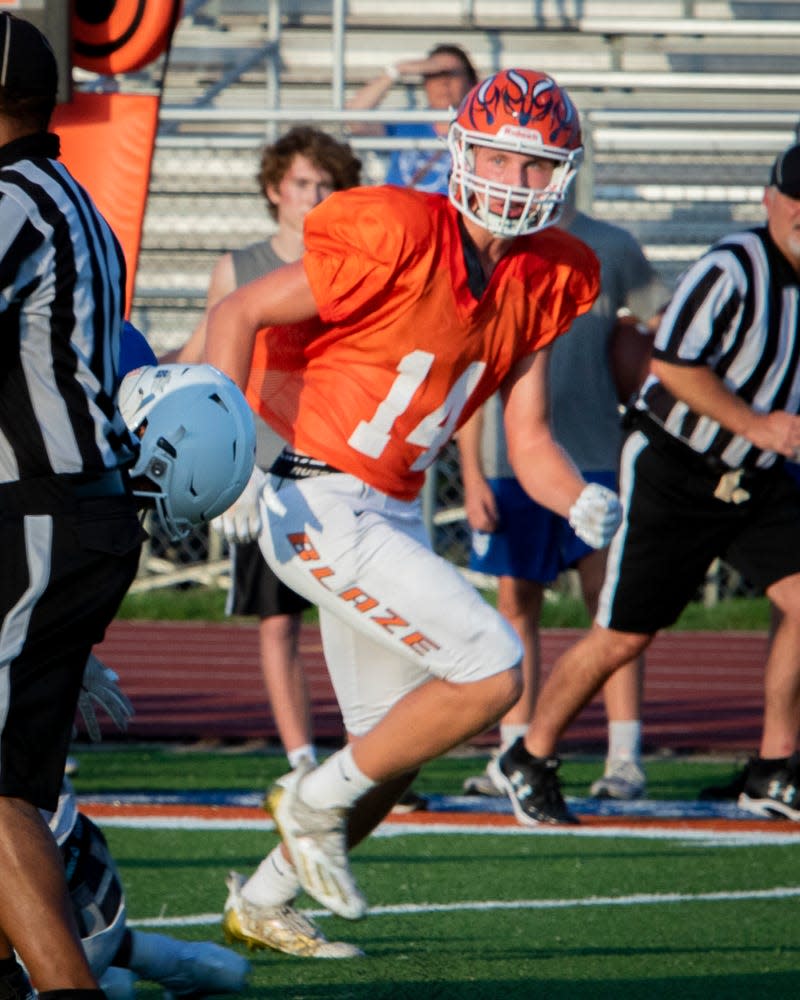 Blackman tight end Ben Marshall heads upfield looking for a pass during Tuesday's scrimmage vs. Lebanon.