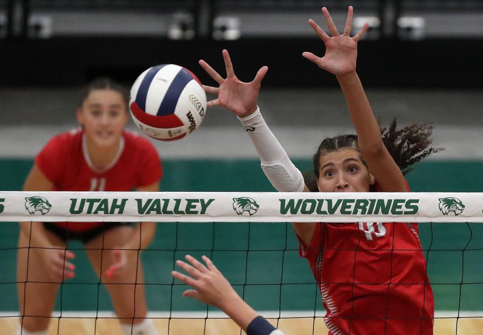 Bountiful’s Taylor Harvey reaches for a block during a 5A volleyball state tournament quarterfinal game against Skyline at the UCCU Center in Orem on Thursday, Nov. 2, 2023. | Kristin Murphy, Deseret News