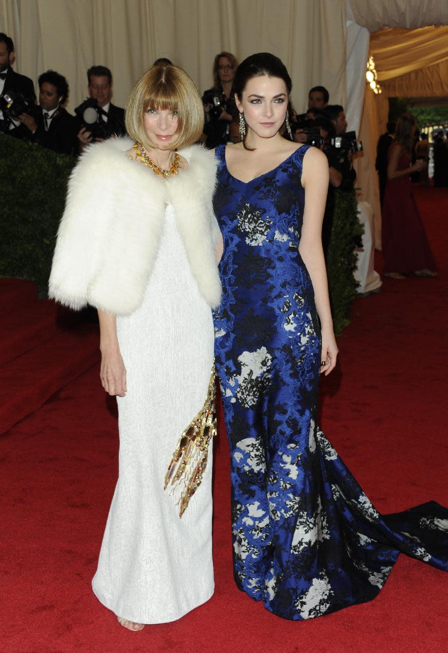 Anna Wintour, left, and Bee Shaffer arrive at the Metropolitan Museum of Art Costume Institute gala benefit, celebrating Elsa Schiaparelli and Miuccia Prada, Monday, May 7, 2012 in New York. (AP Photo/Evan Agostini)