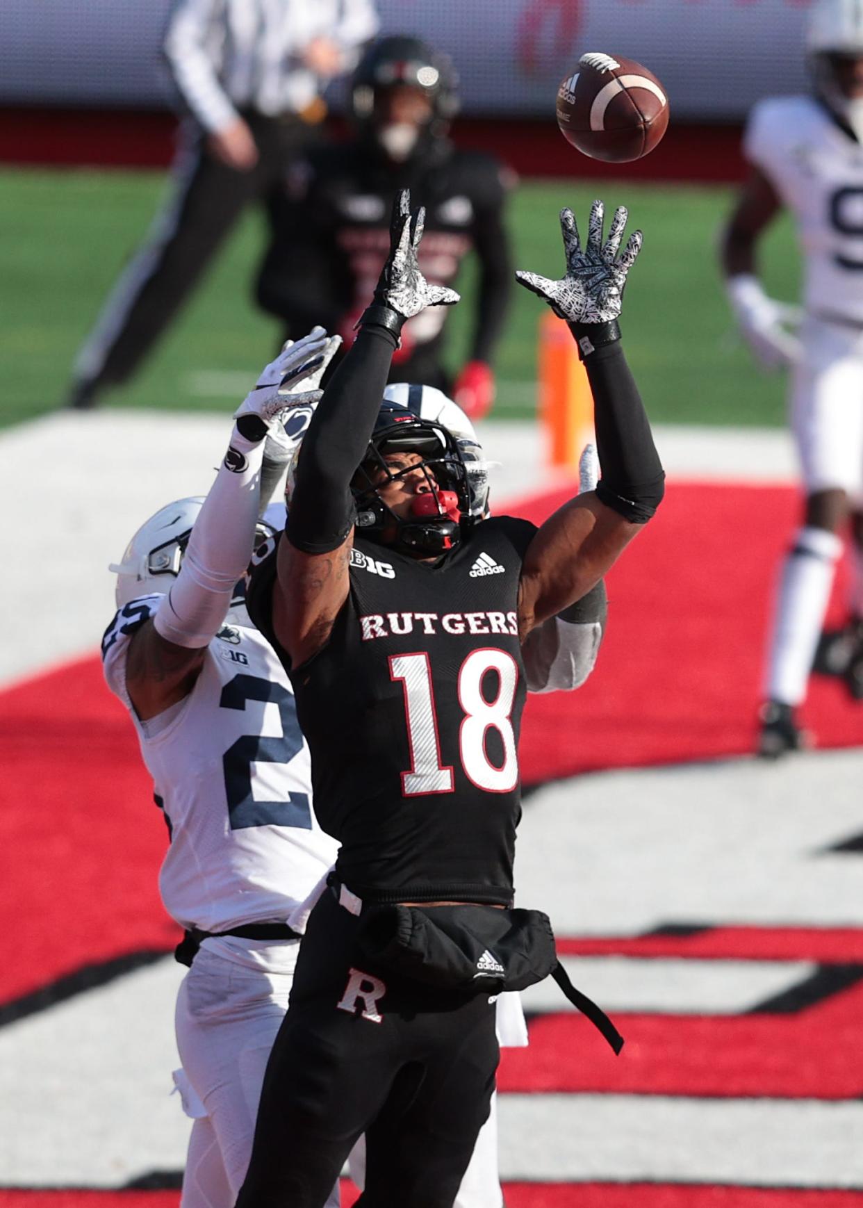 Rutgers wide receiver Bo Melton catches a touchdown pass over Penn State cornerback Daequan Hardy.