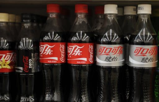 Bottles of Coca-Cola sit on the shelves of a store in Beijing. Authorities in northern China have ordered a Coca-Cola bottling plant shut after finding its products were contaminated by chlorine, according to a government statement