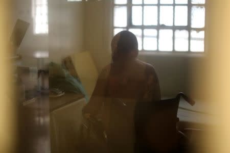 An inmate in a wheelchair sits in his cell at the California Medical Facility prison in Vacaville, California, U.S., May 22, 2018. REUTERS/Lucy Nicholson