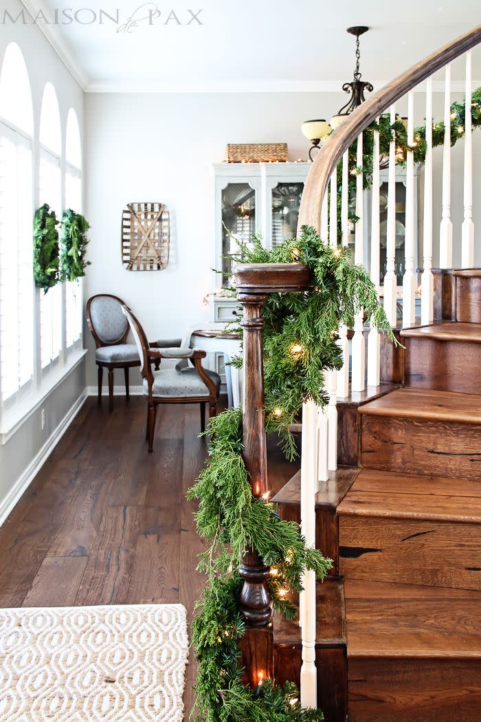 <p>You can't go wrong with classic green garland anywhere in your home—especially when you weave in twinkling lights.</p><p><strong>See more at <a href="https://www.maisondepax.com/tips-for-simple-elegant-holiday-decor/" rel="nofollow noopener" target="_blank" data-ylk="slk:Maison de Pax;elm:context_link;itc:0;sec:content-canvas" class="link ">Maison de Pax</a>.</strong></p><p><a class="link " href="https://www.amazon.com/National-Tree-Crestwood-Operated-CW7-306-9A-B1/dp/B00LKRMWEY/ref=sxin_14?tag=syn-yahoo-20&ascsubtag=%5Bartid%7C10050.g.23362967%5Bsrc%7Cyahoo-us" rel="nofollow noopener" target="_blank" data-ylk="slk:SHOP GARLAND WITH LIGHTS;elm:context_link;itc:0;sec:content-canvas">SHOP GARLAND WITH LIGHTS</a></p>