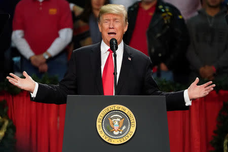 U.S. President Donald Trump speaks at a rally in Pensacola, Florida, U.S., December 8, 2017. REUTERS/Carlo Allegri