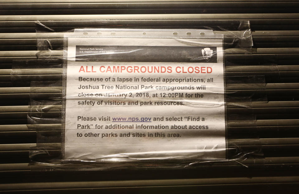 An ‘All Campgrounds Closed’ sign is posted at shuttered entrance station at Joshua Tree National Park on Jan. 3, 2019 in Joshua Tree, California. The gate is normally staffed during the day but is now unstaffed 24 hours per day, allowing free entrance for all visitors. Campgrounds have been closed at the park and other services suspended during the partial government shutdown. (Photo: Mario Tama/Getty Images)