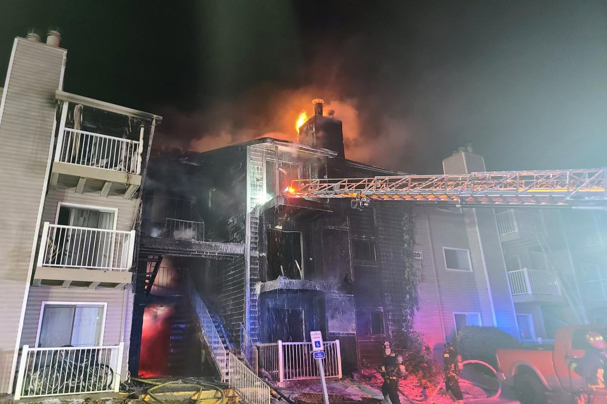 In this photo released by the Aurora Fire Rescue is the scene where a fire swept through a three-story apartment building in Aurora, Colo., Monday, Jan. 24, 2022. Officials in suburban Denver say that a child died after firefighters rescued people unable to escape on their own before dawn. (Aurora Fire Rescue via AP)