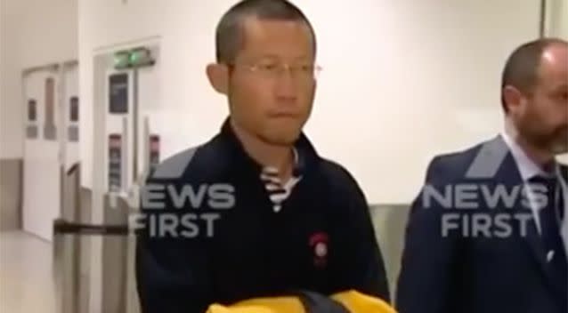 Hongchi Xiao arrived in Sydney on Thursday. Source: 7 News