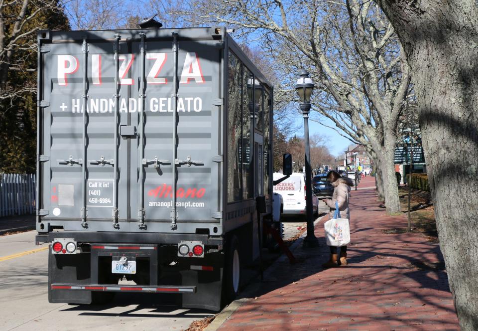 A customer orders from the A Mano food truck stationed on Bellevue Avenue in Newport.