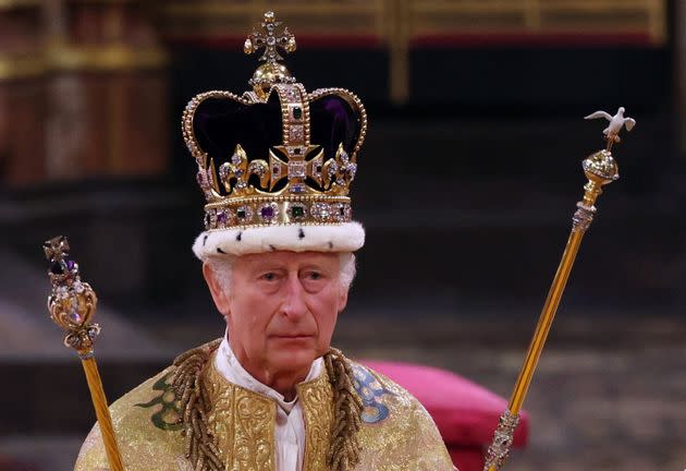 Britain's King Charles III walks wearing St Edward's Crown during the Coronation Ceremony.