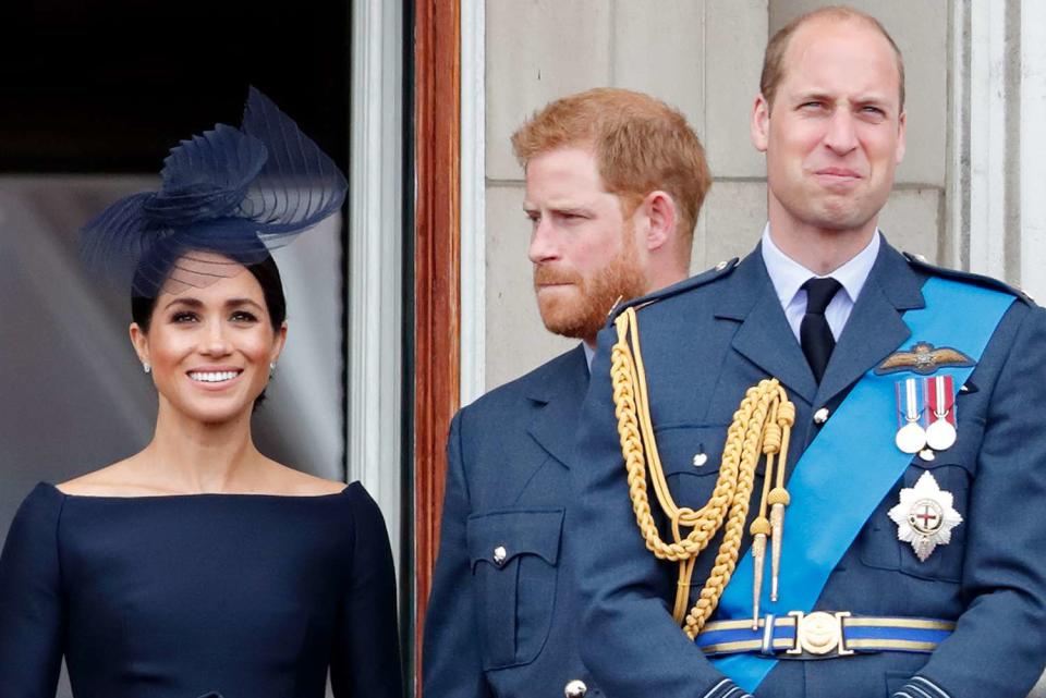 <p>Max Mumby/Indigo/Getty </p> Meghan Markle, Prince Harry and Prince William at the RAF centenary flypast in London in July 2018.