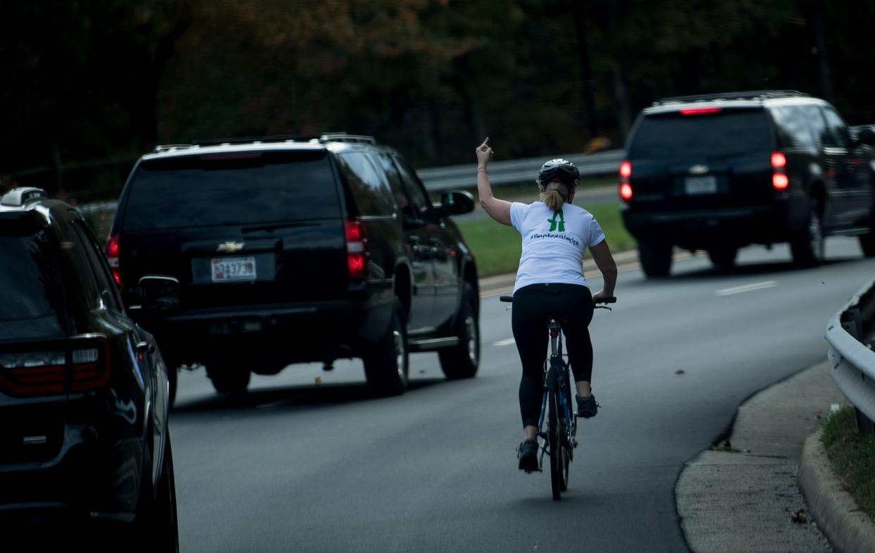 Juli Briskman gave the one-finger salute to President Donald Trump's motorcade last fall. The image went viral. (Photo: Brendan Smialowski/AFP)