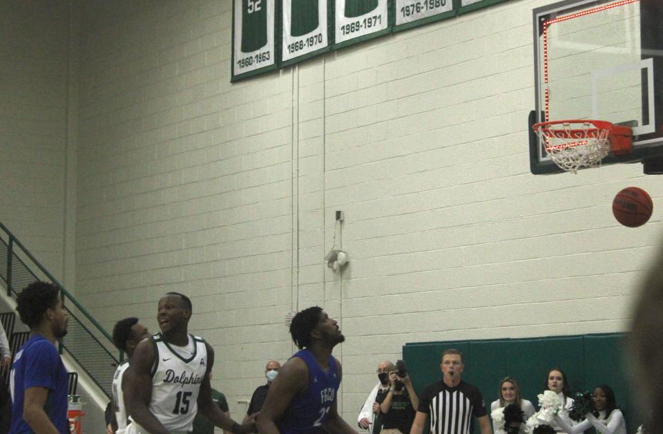 Jacksonville University guard Kevion Nolan's 3-pointer swishes through the net as time expires to defeat Florida Gulf Coast 69-66, as forward Osayi Osifo (15) celebrates, in a men's college basketball game on Saturday, January 8, 2022. [Clayton Freeman/Florida Times-Union]