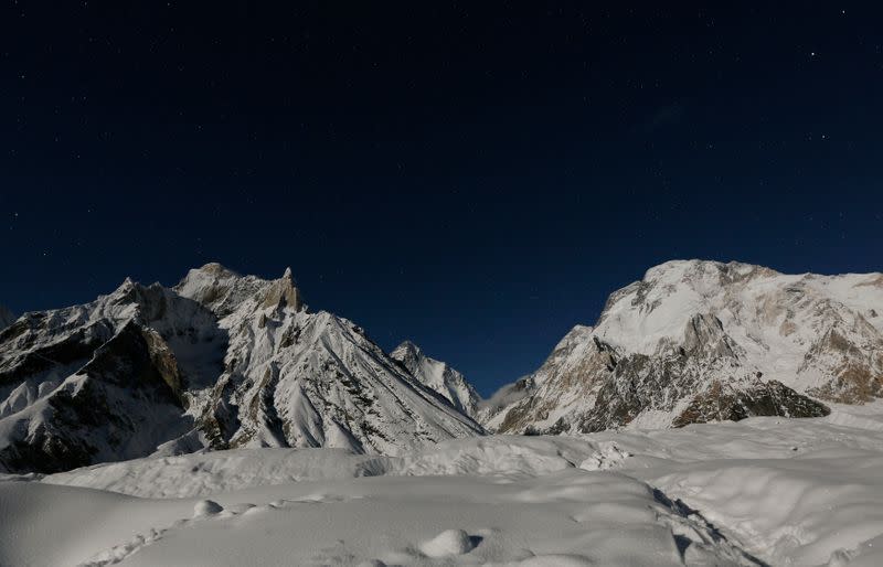 The world's second largest mountain, the 8,611 meter high K2 is illuminated by the moon at Concordia in the Karakoram mountain range in Pakistan