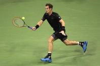 Andy Murray of Britain hits a return to Nick Kyrgios of Australia during their first round match at the U.S. Open Championships tennis tournament in New York, August 31, 2015. REUTERS/Adrees Latif